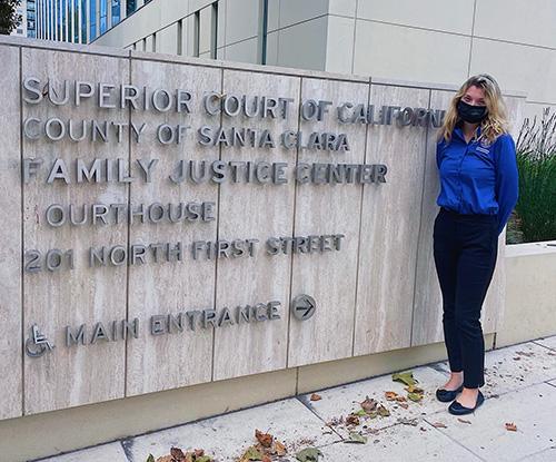Sofia Russell in front of court sign