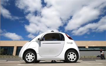 a white Google AI car parked against a backdrop of blue sky with white clouds