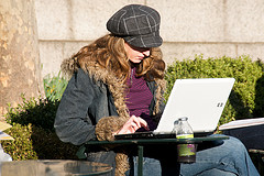 Woman using a laptop outside