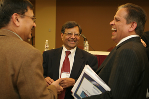Jagdish Sheth, center, chats with conference participants