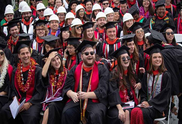 SCU students celebrating at commencement ceremony