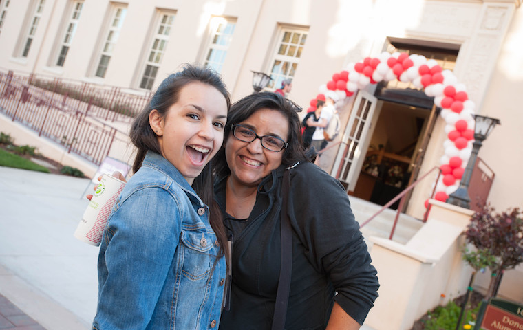 Happy faces in front of Donohoe Alumni House, location of Family Weekend check-in. Photo by Charles Barry