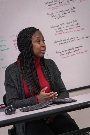 Kayla Williams talks about her database project for Community Health Partnership. Photo by Charles Barry.