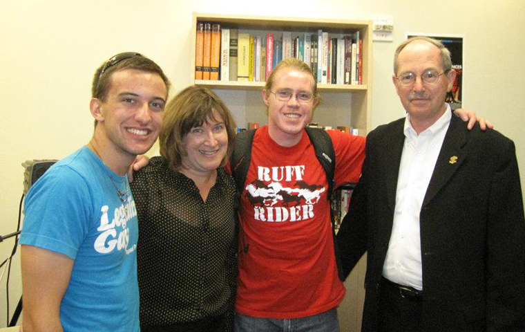 From left, RRC co-founder Kyle Arrouzet '13, Jeanne Rosenberger, Vice Provost for Student Life & Dean of Students, RRC co-founder Devin Wakefield '13 and Michael Engh, S.J., during the grand opening of the Rainbow Resource Center in 2011.