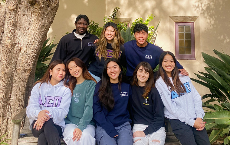 A group of students wearing Delta Sigma Pi clothes.