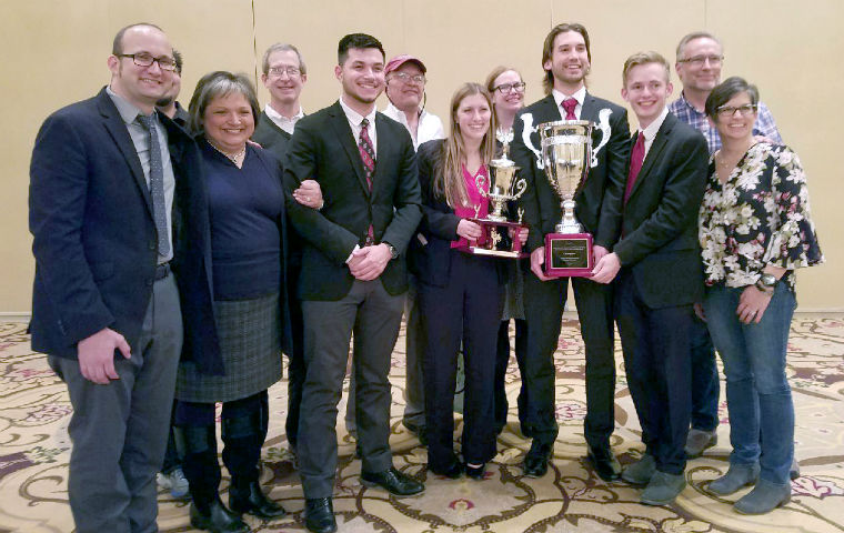 Students and coaches pose with Ethics Bowl trophy in Chicago image link to story