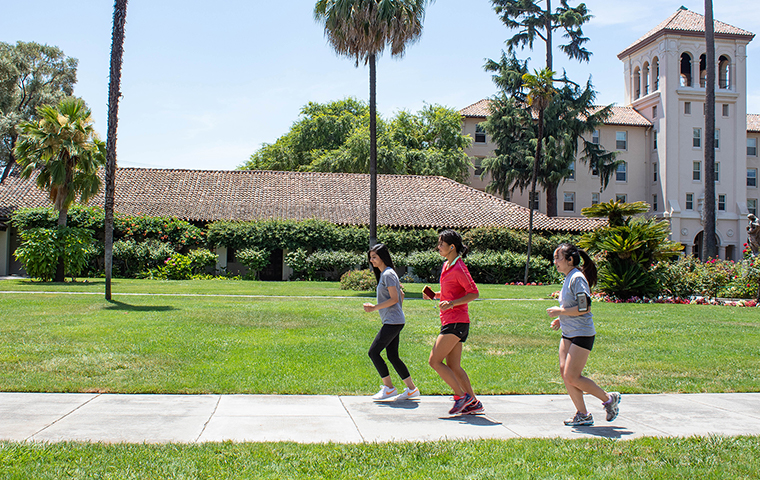 The three creators of the Solemate coaching app test it on a run across campus. Photo by Andrea Yun.