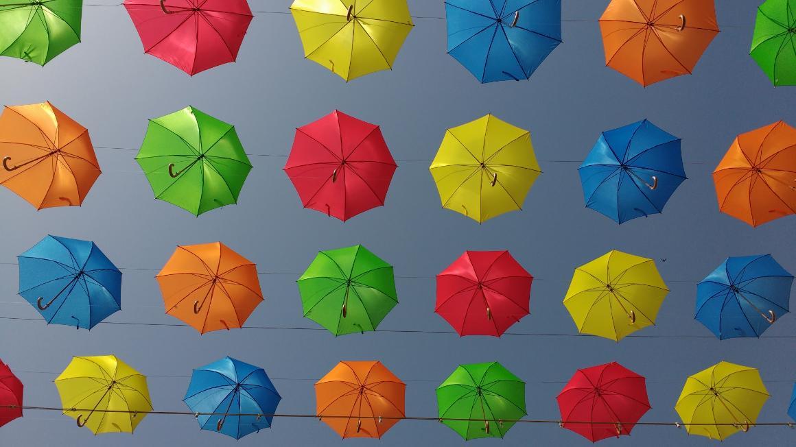 A set of umbrellas of different colors.