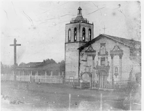 Earliest known daguerrotype photograph of the Mission in 1854. Bell tower is sheathed with planks. Facade is painted with images of St. Clare, Francis and John the Baptist.
