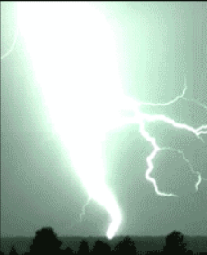 Lightning causing a bright flash and illuminating the sky