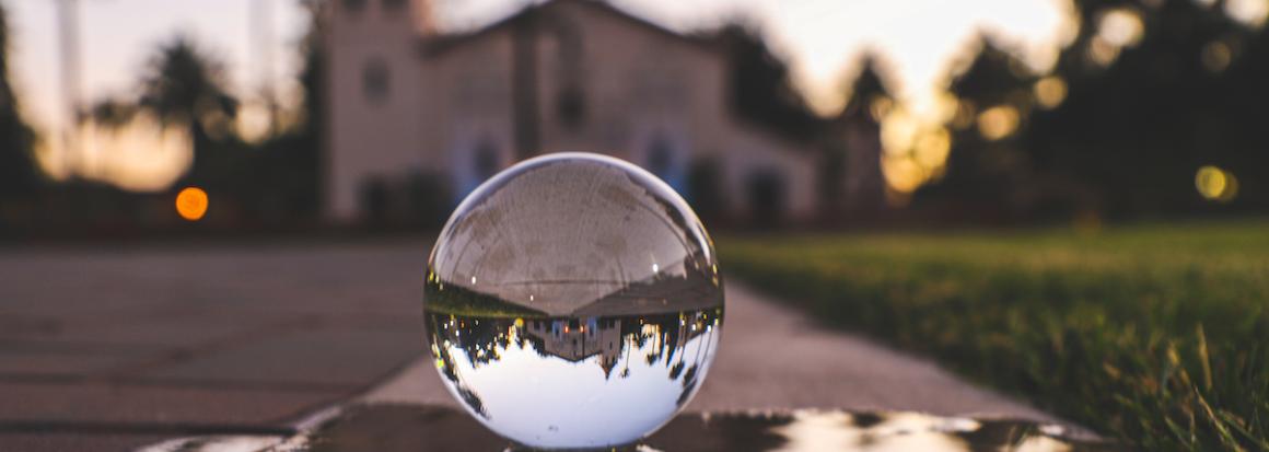 A crystal ball reflects the SCU Mission.