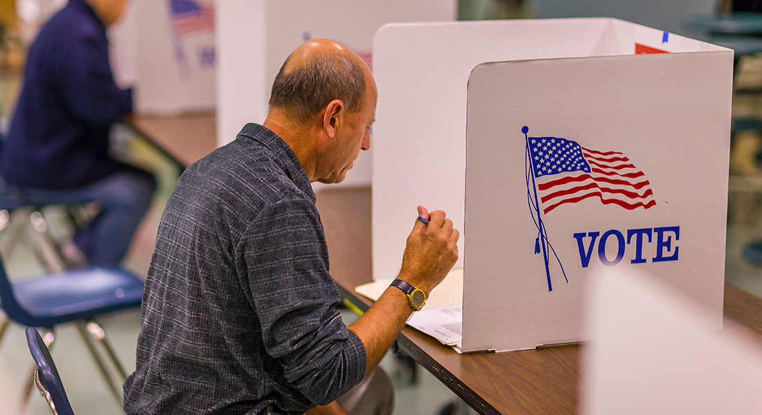 Man sits at voting booth