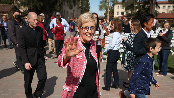 University President Julie Sullivan waving.