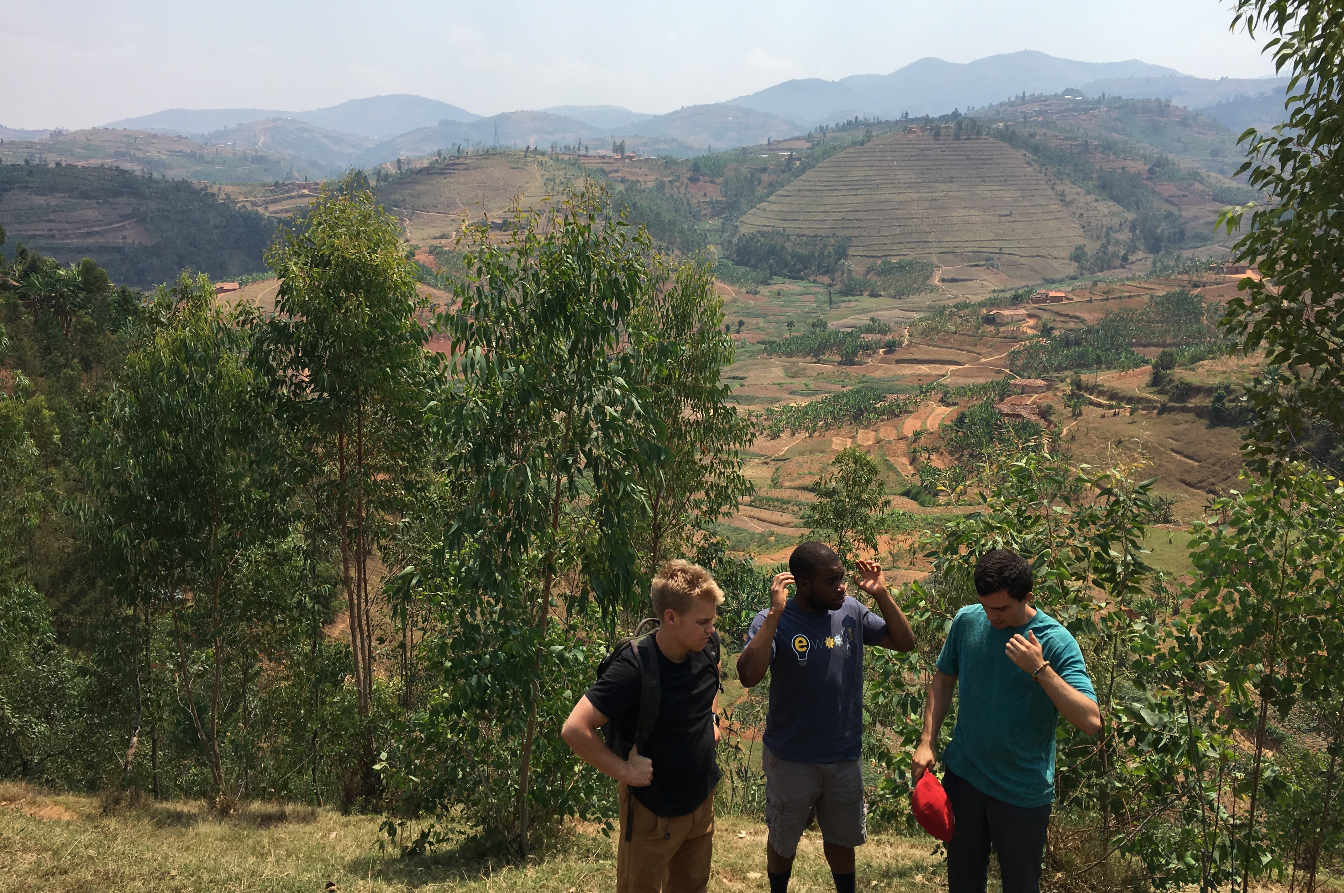 Ben, Uche, and Jon study the terrain for the future clay transport system