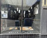 Looking into the Right Window Gallery in San Francisco at an image + text exhibit titled White Paint