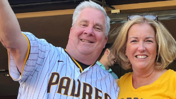 John Seidler and his wife Laurie, both wearing Padres sports gear. 