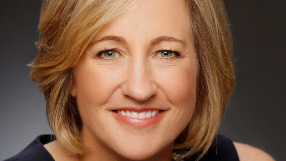 A smiling blonde woman