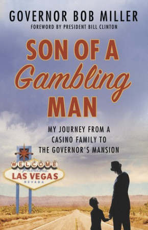 A black silhouette of a man and a child in front of a paved road in the desert, along which stands a Welcome to Las Vegas, Nevada sign. Text in the center of the image reads Son of a Gambling Man. Text above reads Governor Bob Miller. Foreword by President Bill Clinton.