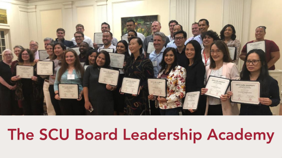 A smiling group of people in business casual dress, holding certificates. Text underneath reads The SCU Board Leadership Academy.
