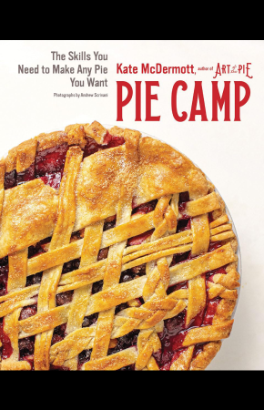 A white backdrop with a pie on top. The pie has a golden brown latticework crust, and red filling is visible through the pieces of pastry. Text above reads Pie Camp. Other, smaller text reads Kate McDermott, author of Art of Pie. The Skills You Need to Make Any Pie You Want. Photographs by Andrew Scrivani.