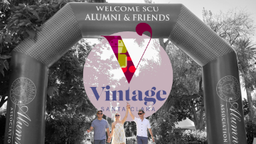 Two men and a woman holding hands underneath an inflatable arch reading Welcome SCU Alumni & Friends. Overlaid is a logo reading Vintage Santa Clara. 