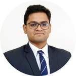 A man wearing glasses and a suit, Om Ambalkar headshot.