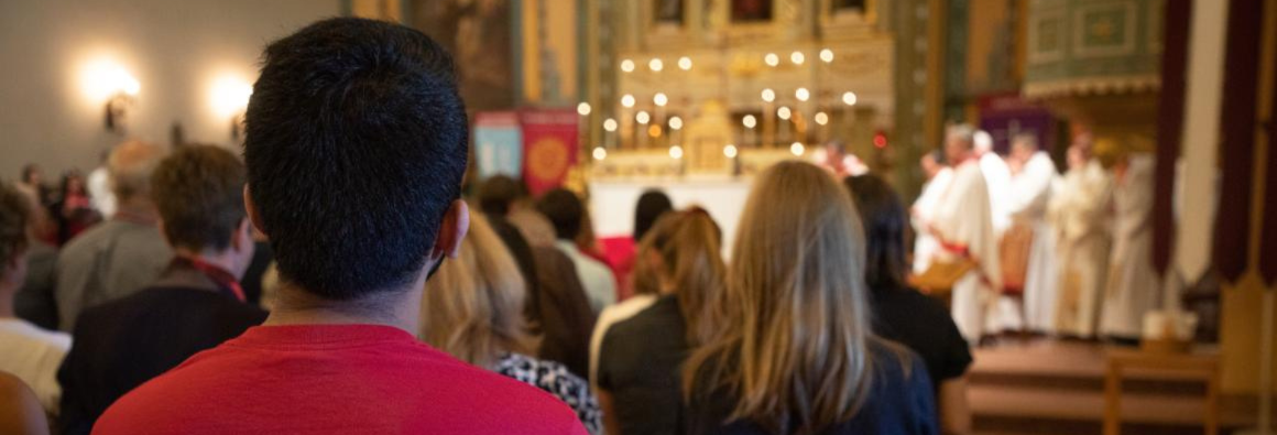 students in mass at mission church