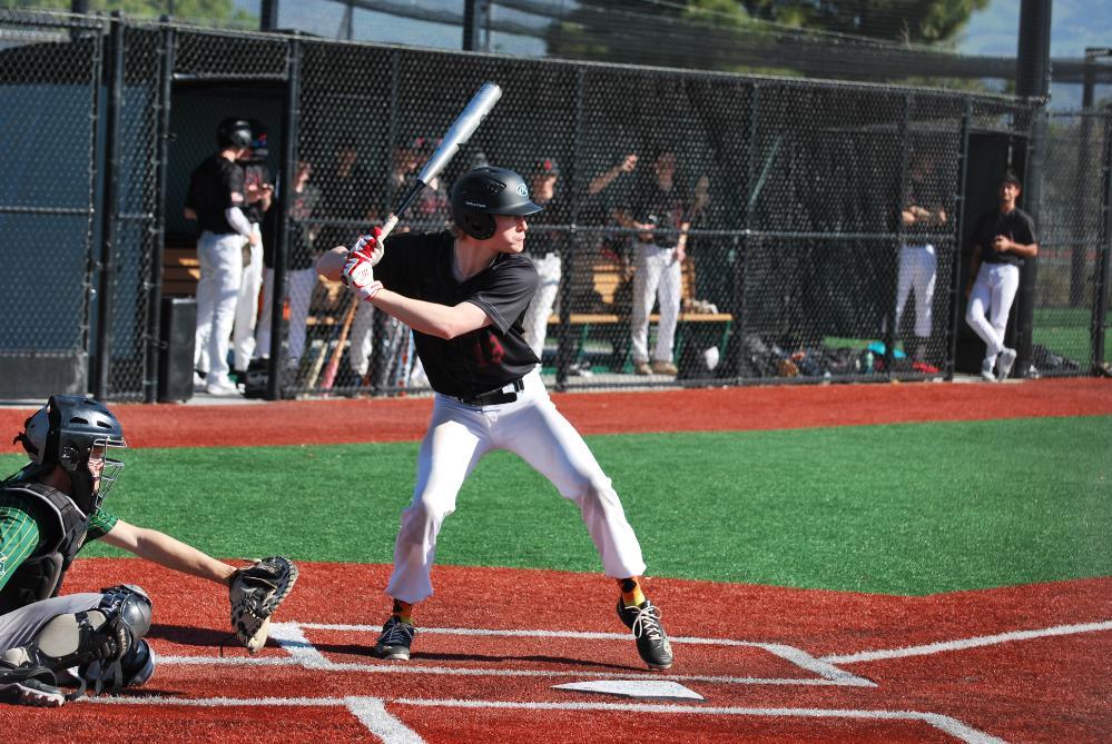 Mens Club Baseball player swinging a bat