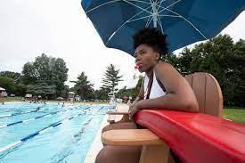 A lifeguard sitting on the post