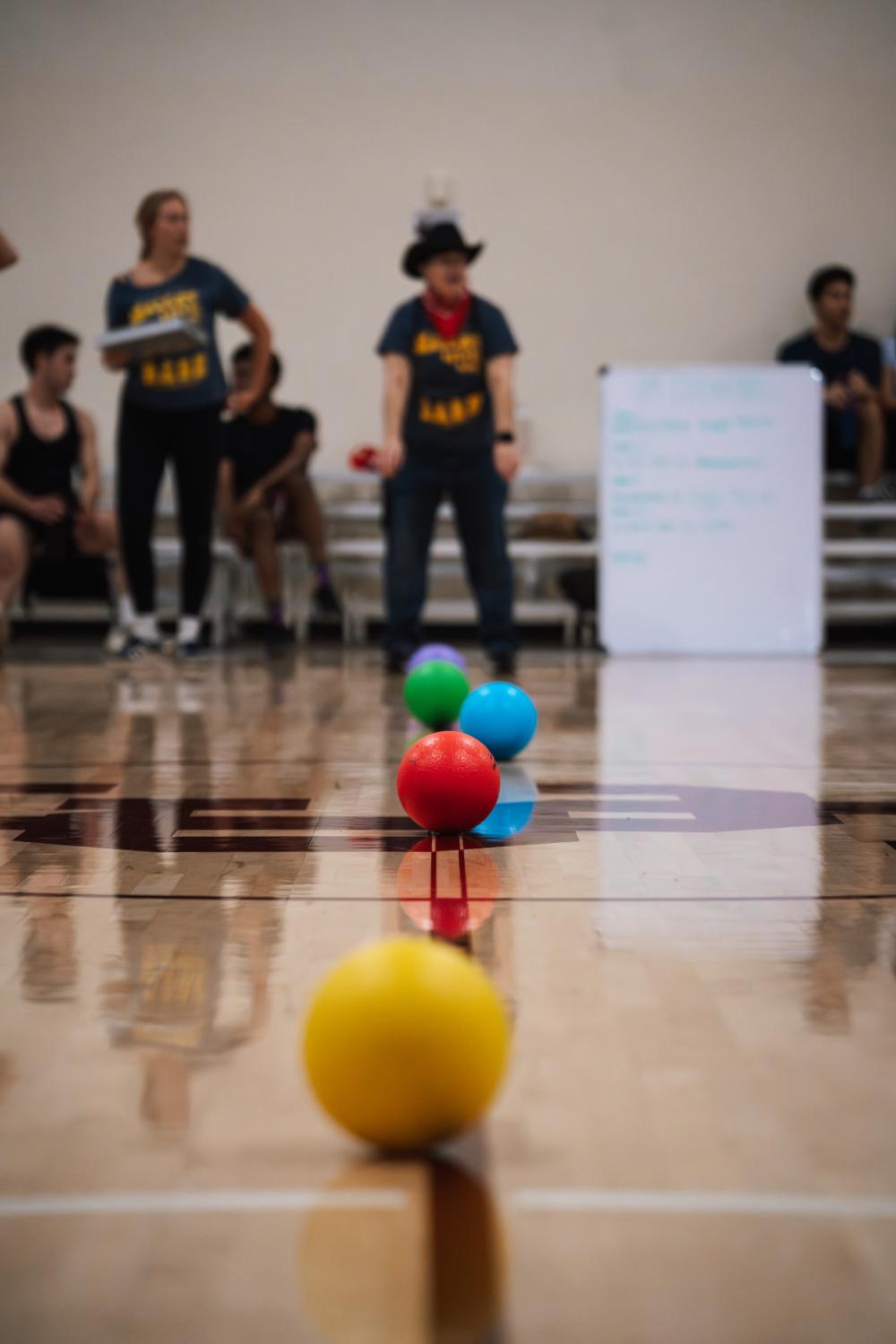 Line of dodgeballs on the basketball court