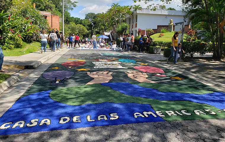 Every Nov. 16, UCA students create mosaics of dyed salt, called alfombra, to honor the memory of the victims of the massacre; this one features the faces of the eight people who died.