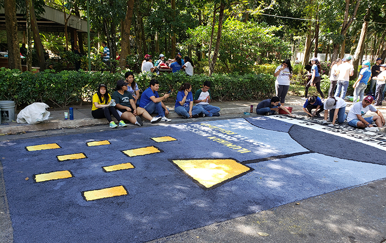 Another design, this one featuring a light shining on eight other lights that symbolize the eight victims.