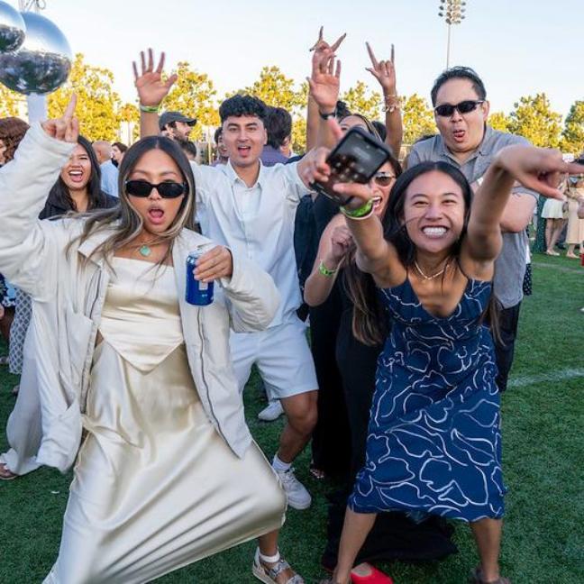 A group of Class of 2025 alumni dancing at Grad Bash 