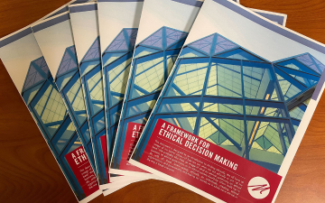 Flyers fanned out on a table. Framework for Ethical Decision Making Markkula Center for Applied Ethics image link to story