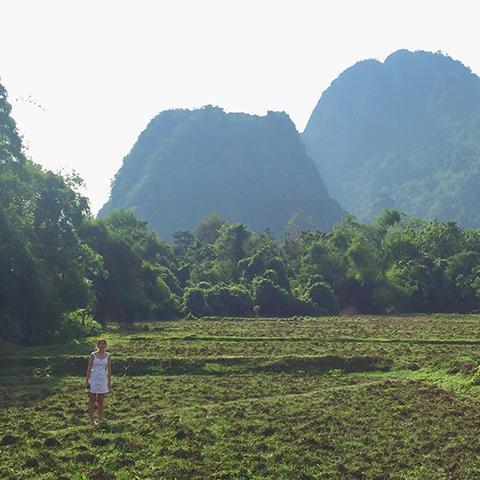 Hana Seastedt and her mountain backdrop in Laos image link to story