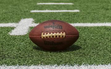 NFL football on field image link to story