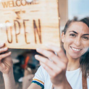 Woman with open sign 