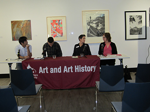 Four people sitting at a table with a banner reading Fair Good Art Workers.