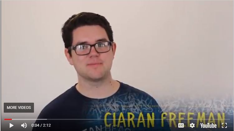 A person with glasses, and text 