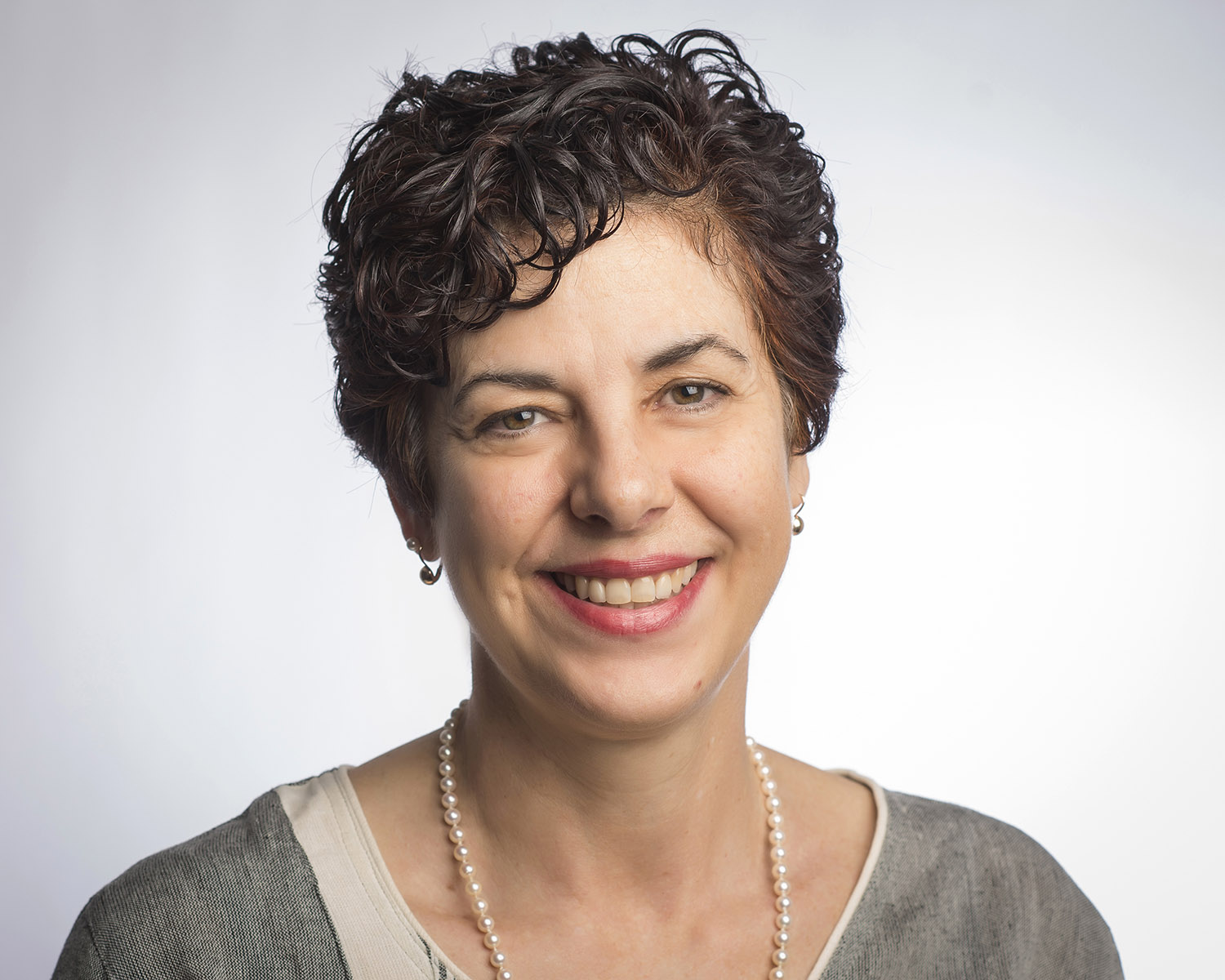 Smiling person against a neutral background titled 'Andrea Papas News'.
