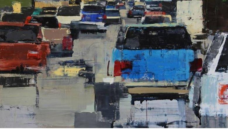 Several cars in traffic during rush hour. image link to story