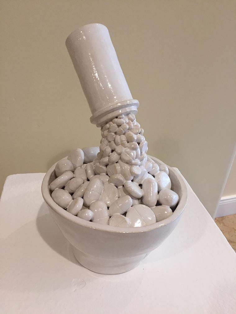 Ceramic artwork displayed on a white surface at CCACA conference. image link to story