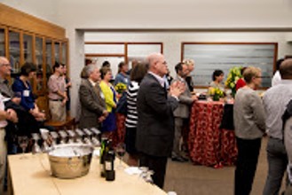 People at a social gathering in a room.