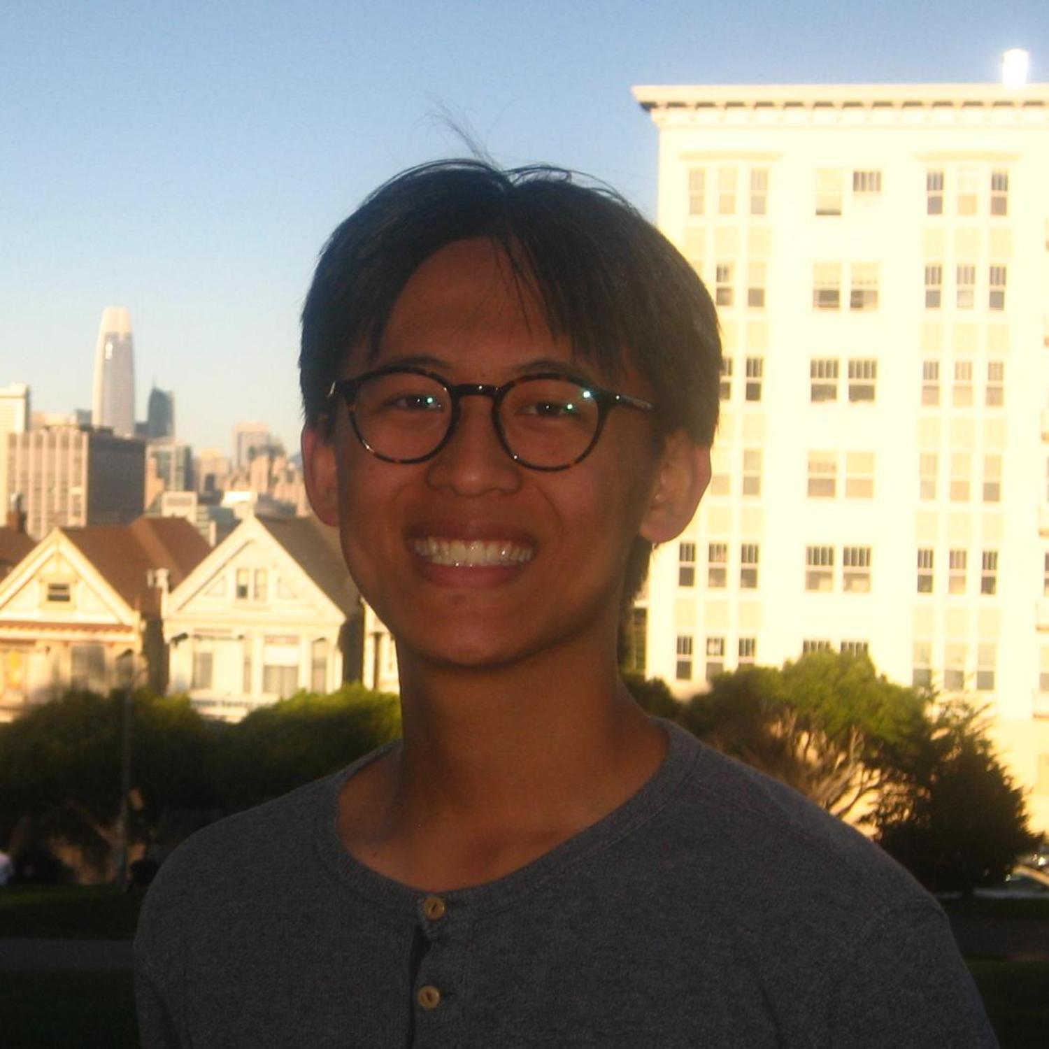 A photo of Julian smiling at the camera