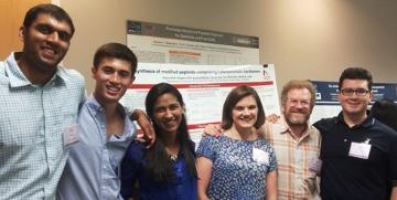 A group photo of six people at Summit 2015. image link to story