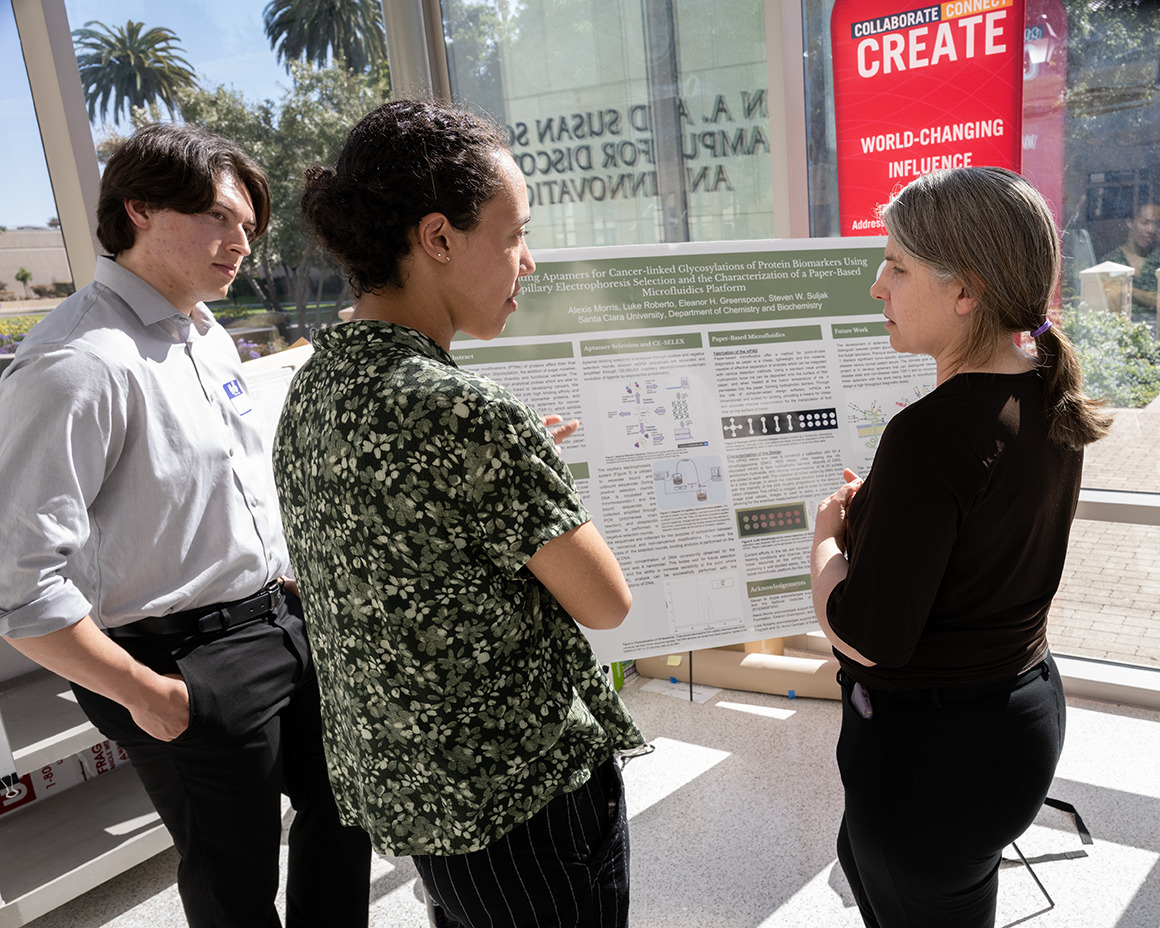 Alexis Morris discusses her research with Biology professor Christelle Sabatier