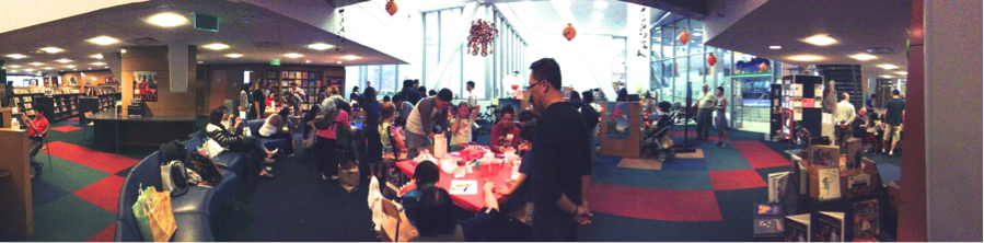 A large group of people in a room with chemistry-themed decorations. image link to story