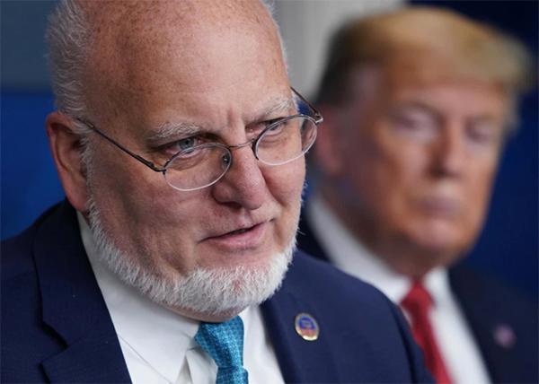 CDC Director Robert R. Redfield speaks as President Donald Trump listens during the daily briefing on the novel coronavirus, which causes COVID-19, in the Brady Briefing Room of the White House in April. (Mandel Ngan/AFP/Getty Images)