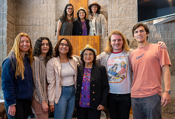 Dolores Huerta with students with an inset image of Dolores Huerta with two faculty