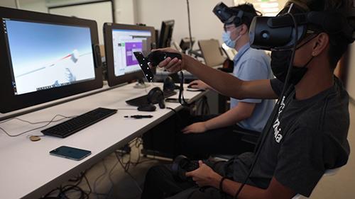 Two students with vr headsets
